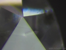 Small diamond cristal included in diamond, producing external graining