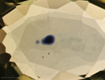 Titanium diffusion halo around of rutile inclusion in strongly heat treated sapphire