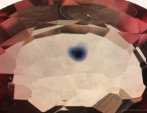 Titanium diffusion halo around of rutile inclusion in strongly heat treated sapphire