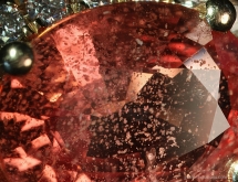 Molten solid inclusion in natural heat-treated orange sapphire