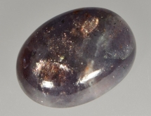 Iridiscent hematite inclusions in iolite sunstone