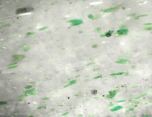 Green fuchsite inclusions in aventurine quartz.