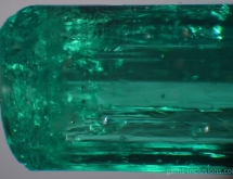 Calcite and pyrite inclusions in emerald