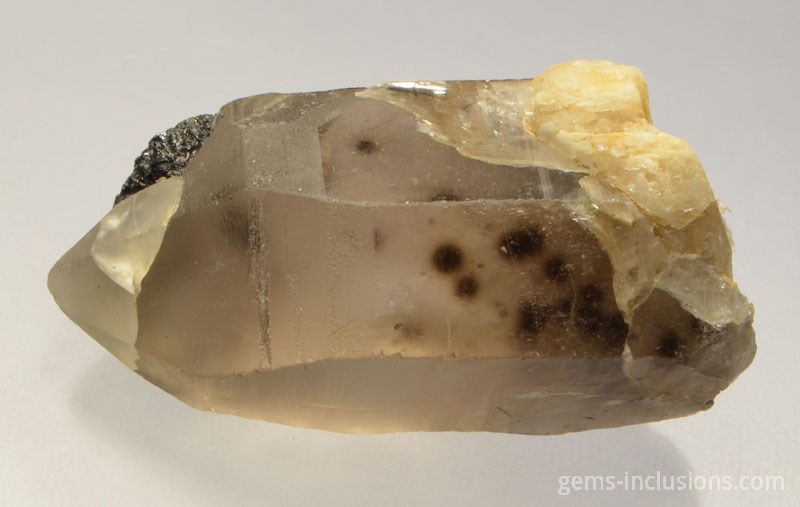 Uraninite in quartz rough